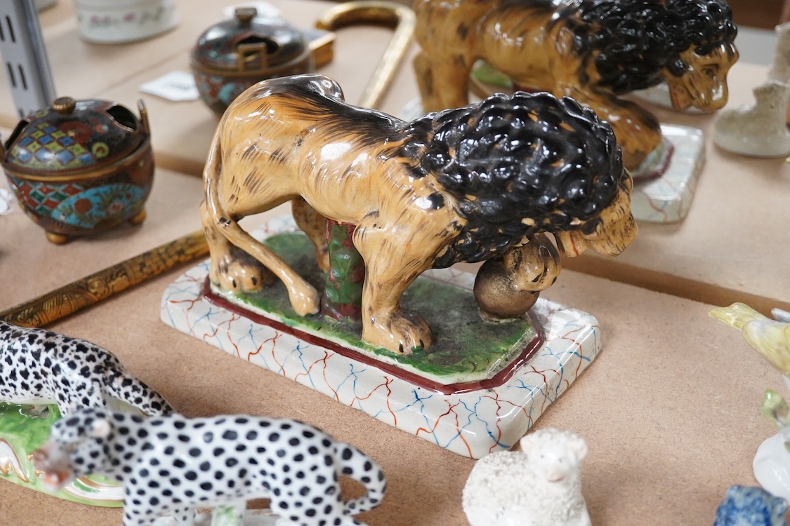 A collection of 19th/20th century Staffordshire and continental porcelain models of animals and birds, including a 20th century Meissen figure of a canary, two Continental porcelain Panthers, two similar recumbent dogs,